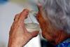 Older woman drinking water