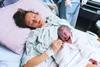 Baby and mother in maternity ward